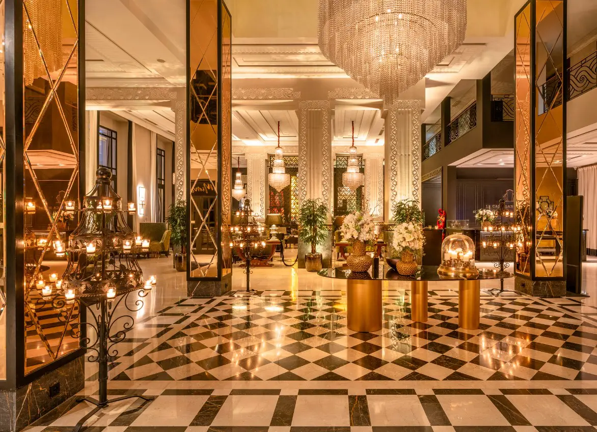 Grand hotel lobby with checkered floor.