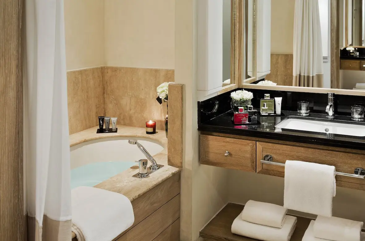 Luxurious bathroom with bathtub and sink.