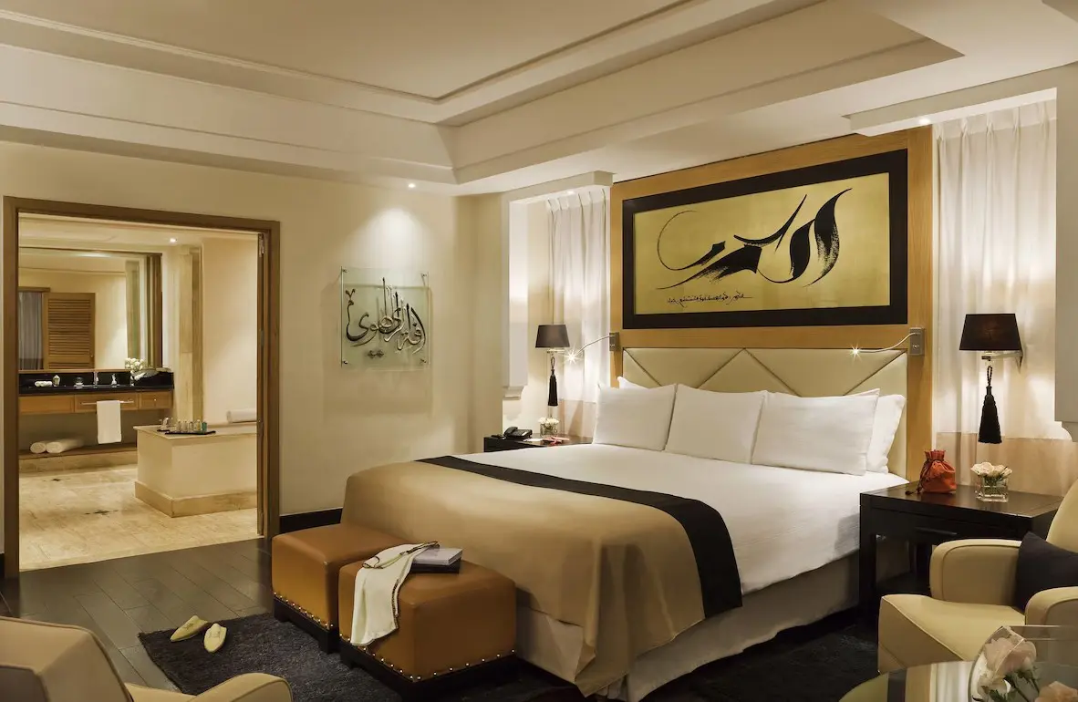 Luxury hotel room with king-size bed.