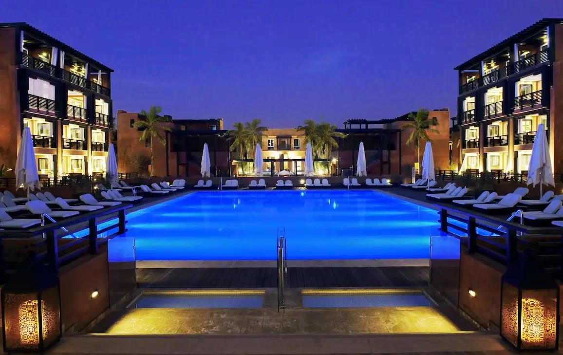 Nighttime view of a resort pool.