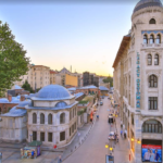 Istanbul street with mosque and buildings.