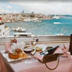 Romantic dinner with city and sea views.