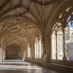 Historic architectural corridor with intricate designs.