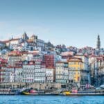 Colorful buildings along a riverside in Porto.