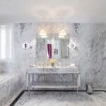 Luxurious marble bathroom with modern fixtures.