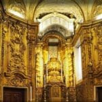 Ornate golden interior of a religious space.