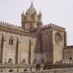 Historic castle with towers and arches.