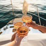 Cheers with champagne on a yacht.