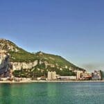 Gibraltar Rock overlooking a coastal city.