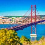 The 25th April Bridge (Ponte 25 de Abril) in Lisbon, Portugal. View from Almada.