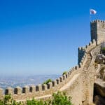 "Castle of the Moors, also known as Castelo dos Mouros, in Sintra, Portugal with a flag bearing the Portuguese Shield. Other images of Sintra:"