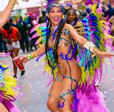 Colorful dancer in vibrant carnival costume.