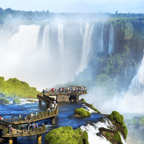 Tourists on a bridge overlooking Iguazu Falls.